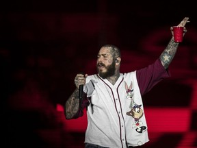 FILE - American rapper Post Malone performs during the Rock in Rio music festival in Rio de Janeiro, Brazil, early Sunday, Sept. 4, 2022. On Sunday, Sept. 18, 2022, Post Malone sent an apology to his St. Louis fans on social media for an on-stage accident that sent him to the hospital and shortened his set the night before.