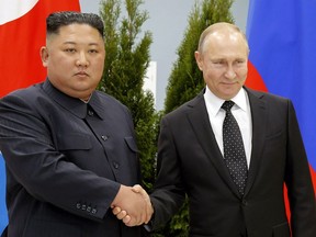 FILE - Russian President Vladimir Putin, right, and North Korea's leader Kim Jong Un shake hands during their meeting in Vladivostok, Russia, April 25, 2019. North Korea says it has not exported any weapons to Russia during the war in Ukraine and has no plans to do so, and said U.S. intelligence reports of weapons transfers were an attempt to tarnish North Korea's image.