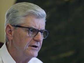 FILE - Gov. Phil Bryant speaks about his legacy following a life of public service, Jan. 8, 2020, in his office at the Capitol in Jackson, Miss. Newly revealed text messages show how deeply involved the former Mississippi governor was in directing more than $1 million in welfare money to retired NFL quarterback Brett Favre. The texts were in court documents filed Monday, Sept. 12, 2022, in state court by an attorney for the nonprofit known as the Mississippi Community Education Center.