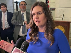 FILE - Arkansas Republican gubernatorial candidate Sarah Sanders talks to reporters at the Arkansas state Capitol in Little Rock, Ark., on Feb. 22, 2022, after filing paperwork to run for governor. The former White House press secretary underwent surgery Friday, Sept. 16, 2022, for thyroid cancer.