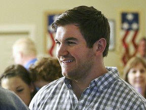 FILE - Alek Skarlatos, at the Douglas County Republican Party headquarters in Roseburg, Ore., May 15, 2018. Alek Skarlatos, a Republican nominee for Congress in Oregon, was cleared this week of violating campaign finance law. The development came months after a Democratic-aligned group filed a complaint with the Federal Election Commission, alleging he improperly funded his campaign with money from a nonprofit he also controlled. The use of the money was detailed in an Associated Press story last year, which formed the basis of the complaint filed by a Democrat-aligned group. Skarlatos campaign says he feels vindicated.