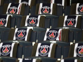 FILE - The logos of the Paris Saint Germain are displayed on the seats of the VIP stands prior to the Champion's League round of 16, first leg soccer match between Paris Saint Germain and Barcelona at the Parc des Princes stadium in Paris, Tuesday, Feb. 14, 2017. Paris Saint-Germain has defended its use of chartered flights rather than more ecological trains after an executive for France's high-speed rail network called out the club for flying its players on a short-haul to Nantes Saturday Sept.4 2022.