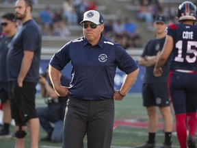 Danny Maciocia the head coach and general manager of the Montreal Alouettes watches his team warm up prior to CFL action against the Edmonton Elks in Montreal on Thursday July 14, 2022.