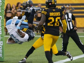 Toronto Argonauts wide receiver Markeith Ambles (17) does a flip in the air as he crosses into the end zone for a touchdown during first quarter CFL football game action against the Hamilton Tiger Cats in Hamilton, Ont. on Monday, September 5, 2022.