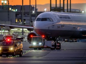 A Lufthansa aircrafts is pulled to a park position at the airport in Frankfurt, Germany, Friday, Sept.2, 2022. Hundreds of Lufthansa flights have been canceled as pilots stage a one-day strike to press their demands for better pay and conditions at Germany's biggest carrier.