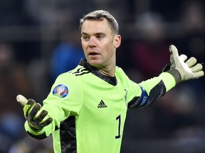 FILE --Germany's keeper Manuel Neuer plays during the Euro 2020 group C qualifying soccer match between Germany and Belarus in Moenchengladbach, Germany, Saturday, Nov. 16, 2019. Germany captain Manuel Neuer will wear an armband against discrimination to promote diversity at the World Cup in Qatar