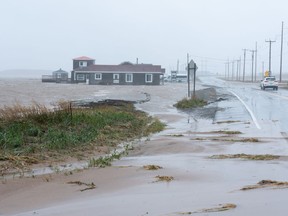 Youth hostel Paradis Bleu is surrounded by high water caused by post-tropical storm Fiona on the Les Îles-de-la-Madeleine, Que., Saturday, Sept. 24, 2022.