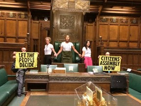 Extinction Rebellion activists protest inside the House of Commons in London, Britain September 2, 2022 in this picture obtained from social media.
