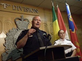 Regina police Chief Evan Bray, left, speaks while RCMP Assistant Commissioner Rhonda Blackmore, right, looks on during a press conference at RCMP "F" Division Headquarters in Regina on Monday, Sept. 5, 2022. An ongoing manhunt for the remaining suspect in a stabbing spree that shattered a small Saskatchewan community is raising fresh questions about rural policing in Canada. Police are continuing to search for Myles Sanderson.