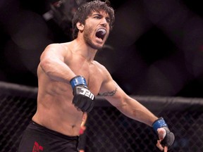 Elias (The Spartan) Theodorou celebrates his win over Sheldon Wescott at the UFC Fight Night in Quebec City, Wednesday, April 16, 2014. Theodorou, a charismatic mixed martial artist who campaigned successfully for the right use medical marijuana as an athlete, has died. He was 34.
