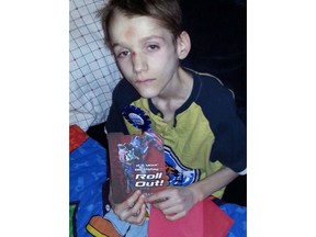 Alexandru Radita is shown in a photo from his 15th birthday party, three months before his death, in this handout photo. An Alberta judge looking into the death of they boy has adjourned her inquiry in an attempt to get more witnesses.