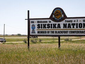 A sign greets people on the Siksika First Nation, east of Calgary near Gliechen, Alta., on June 29, 2021. After 20 years, Siksika Nation has re-instated their self-administered police service after the nation and provincial government successfully brokered a deal with the federal minister of public safety.