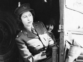 Britain's Princess Elizabeth sits at the driving wheel of an ambulance in April, 1945 after completing a course of driving instruction at the A.T.S. Center to be an officer. Queen Elizabeth didn't make bold proclamations about the rights of women but rather it was in her small, everyday deeds that she advanced the feminist cause, experts say.THE CANADIAN PRESS /AP Photo, File