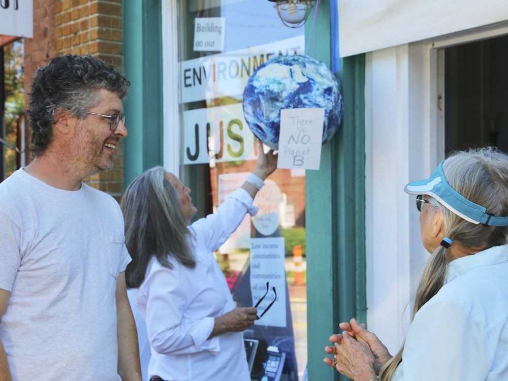 Warrenton, N.C., business owner Gabriel Cumming transformed his storefront into a display honoring the bravery of local demonstrators who returned to Warren County for a ceremony on Saturday, Sept. 24, 2022, forty years after they protested the dumping of toxic soil in 1988.