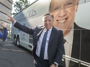 Coalition Avenir Québec Leader François Legault walks back to his bus while campaigning Wednesday, Sept. 7, 2022 in Montreal.