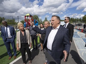 Coalition Avenir Québec Leader François Legault visits a school while campaigning Wednesday, Aug. 31, 2022, in Montreal. Quebec votes in the provincial election Oct. 3.