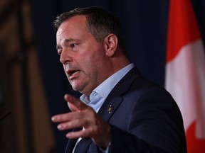 Alberta Premier Jason Kenney answers questions during a press conference in Victoria on July 12, 2022. He said Tuesday that his party was founded on a strong Alberta within Confederation and he won't sit idly by while a "risky, dangerous, half-baked," "banana republic" plan for more provincial independence is floated by one of the candidates vying to replace him.