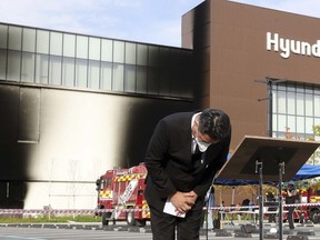 Jung Ji-sun, chairman of Hyundai Department Store Group bows in apology at a shopping mall firevin Daejeon, South Korea, Monday, Sept. 26, 2022. The fire broke out in the basement of the shopping mall Monday, killing a number of people, officials said. (Yang Young-suk/Yonhap via AP)