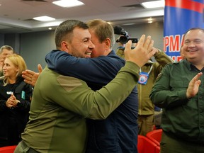 Head of the self-proclaimed Donetsk People's Republic Denis Pushilin and Secretary of the United Russia Party's General Council Andrey Turchak celebrate preliminary results of a widely discredited referendum on joining Russia, in Donetsk, Ukraine September 27, 2022.