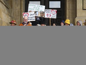 Sally Lane, middle, Canadian mother of Jack Letts, stands on the steps of the Prime Minister's office in Ottawa on Thursday May 19, 2022, with supporters to request an urgent meeting with the prime minister and foreign affairs minister. The federal government has told United Nations officials that international human rights law does not obligate Canada to actively facilitate the return of its citizens detained in northern Syria.