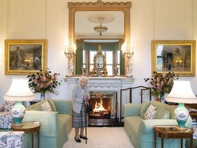FILE - Britain's Queen Elizabeth II waits in the Drawing Room before receiving Liz Truss for an audience at Balmoral, where Truss was be invited to become Prime Minister and form a new government, in Aberdeenshire, Scotland, Tuesday, Sept. 6, 2022. Buckingham Palace says Queen Elizabeth II is under medical supervision as doctors are "concerned for Her Majesty's health." The announcement comes a day after the 96-year-old monarch canceled a meeting of her Privy Council and was told to rest.