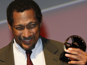 FILE - U.S. writer Percival Everett holds his trophy after he was awarded with the Literary Award at the 38th American Film Festival Sept. 5, 2012, in Deauville, Normandy, France. American authors Elizabeth Strout and Percival Everett are up against writers from Britain, Ireland, Zimbabwe and Sri Lanka as finalists for the prestigious Booker Prize for fiction.