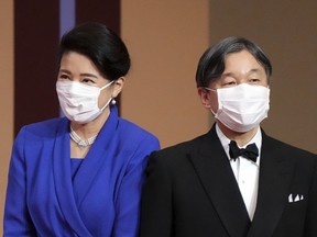 FILE - Japan's Emperor Naruhito and Empress Masako attend the Japan Prize presentation ceremony in Tokyo on April 13, 2022. Japanese emperor and empress will travel to Britain to attend Queen Elizabeth II's state funeral next week to pay respects to her, Japan's top government spokesperson said Wednesday, Sept. 14, 2022.