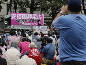 Protesters gather a park in Tokyo Friday, Sept. 23, 2022, demanding the cancellation of former Japanese Prime Minister Shinzo Abe's state funeral.