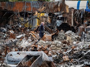 A local resident walks by a street market destroyed by military strikes, as Russia's invasion of Ukraine continues, in Saltivka, one of the most damaged residential areas of Kharkiv, Ukraine Sept. 6.