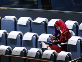 An attendee sits in the gallery during the 77th session of the United Nations General Assembly, at U.N. headquarters, Tuesday, Sept. 20, 2022.