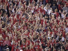 The Utah student section show their support during the first half of an NCAA college football game against San Diego State and Utah Saturday, Sept. 17, 2022, in Salt Lake City. A University of Utah student was arrested on suspicion of making terrorist threats after police said she threatened to detonate a nuclear reactor if the school's football team failed to win a game last Saturday. Charging documents filed in Salt Lake City on Wednesday, Sept. 21, 2022 allege that the student posted threats before Utah's game against San Diego State University on Saturday.