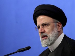 In this photo released by the official website of the office of the Iranian Presidency, President Ebrahim Raisi speaks during a press conference in Tehran, Iran, Monday, Aug. 29, 2022. In a rare news conference Monday marking his first year in office, Raisi warned that any roadmap to restore Tehran's tattered nuclear deal with world powers must see international inspectors end their probe on man-made uranium particles found at undeclared sites in the country. (Iranian Presidency Office via AP)wld