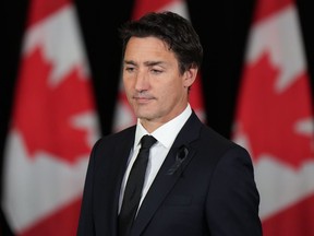 Prime Minister Justin Trudeau wears a black ribbon on his lapel as he arrives to deliver a statement on the passing of Queen Elizabeth II in Vancouver on Thursday, September 8, 2022. Prime Minister Justin Trudeau and British Columbia Premier John Horgan met over lunch in Vancouver on Friday, before Trudeau was set to travel back to Ottawa following a three-day cabinet retreat marked by the death of Queen Elizabeth II.THE CANADIAN PRESS/Darryl Dyck