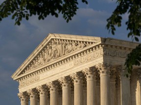 FILE - The U.S. Supreme Court building is shown on May 4, 2022, in Washington. The Supreme Court says it will continue providing live audio broadcasts of arguments in cases, even as it welcomes the public back to its courtroom for a new term that begins Monday.