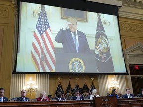 FILE - A video of President Donald Trump recording a statement on Jan. 7, 2021, is played, as the House select committee investigating the Jan. 6 attack on the U.S. Capitol holds a hearing at the Capitol in Washington, July 21, 2022. The House Jan. 6 committee is eyeing a close to its work and a final report laying out its findings about the U.S. Capitol insurrection by the end of the year. But the investigation is not over.