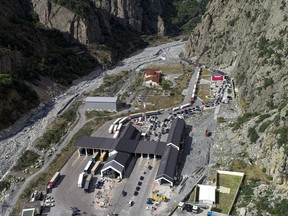 An aerial view of the border crossing at Verkhny Lars between Georgia, bottom, and Russia, in Georgia, Wednesday, Sept. 28, 2022. Long lines of vehicles have formed at a border crossing between Russia's North Ossetia region and Georgia after Moscow announced a partial military mobilization. A day after President Vladimir Putin ordered a partial mobilization to bolster his troops in Ukraine, many Russians are leaving their homes.