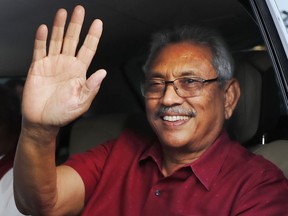 FILE- Sri Lanka's president elect Gotabaya Rajapaksa waves to supporters as he leaves the election commission after the announcement of his victory in Colombo, Sri Lanka, Sunday, Nov. 17, 2019, file photo. The ousted President is expected to return home Friday, Sept. 2, 2022, more than seven weeks after he fled the country amid mass protests that demanded his resignation, holding him and his family responsible for the country's economic crisis.