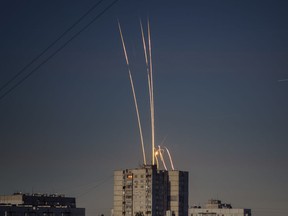 Russian rockets launched against Ukraine from Russia's Belgorod region are seen at dawn in Kharkiv, Ukraine, early Friday, Sept. 9, 2022.