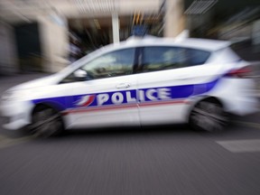 A French Police car patrols in Paris, France, Thursday, Sept. 8, 2022. A French police officer is in custody after shooting to death a driver who failed to obey an order to stopin the southern French city of Nice on Wednesday. This is the latest in a string of similar incidents that are raising questions about the use of deadly force by French police.
