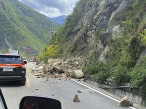 In this photo released by Xinhua News Agency, fallen rocks are seen on road heading to Luding county, the epicentre of a quake in southwest China's Sichuan Province, Monday, Sept. 5, 2022. Many people were reported killed in a 6.8 magnitude earthquake that shook China's southwestern province of Sichuan on Monday, triggering landslides and shaking buildings in the provincial capital of Chengdu, whose 21 million residents are already under a COVID-19 lockdown.