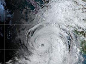 This satellite image made available by NOAA shows Hurricane Kay off the Pacific coast of Mexico, early Wednesday, Sept. 7, 2022. Kay's maximum sustained winds rose to 100 mph Wednesday, with forecasters saying it could brush the mid portion of the peninsula this week. (NOAA via AP)
