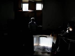 Votes rest inside a ballot box during a plebiscite on a new draft of the Constitution in Santiago, Chile, Sunday, Sept. 4, 2022. Chileans are deciding if they will replace the current Magna Carta imposed by a military dictatorship 41 years ago.