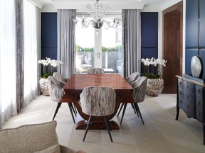 The dining area is distinguished by blue embossed-leather panels with nickel inlays.