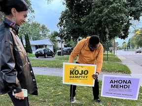 Hamilton school board candidate Anona Mehdi, left, campaigns ahead of the Oct. 24 municipal election.