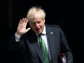 Britain's former Prime Minister, Boris Johnson, leaves 10 Downing Street to attend Prime Minister's Questions in the House of Commons on July 13, 2022 in London, England.