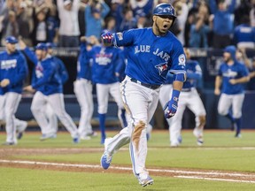 Toronto Blue Jays' Edwin Encarnacion celebrates after hitting a walk-off three-run home run during 11th inning American League wild-card game action against the Baltimore Orioles in Toronto, Tuesday, Oct. 4, 2016. The old single wild-card game format had its share of critics, but it frequently delivered the drama.THE CANADIAN PRESS/Mark Blinch