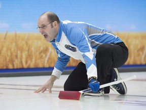 Quebec skip Jean-Michel Menard calls the sweep as they play Alberta in draw 11 action at the Tim Hortons Brier curling championship at Mile One Centre in St. John's on Wednesday, March 8, 2017. Menard scored three points in the extra end for a 9-6 victory over Finland's Markus Sipila on Friday at the world mixed curling championship.&ampnbsp;THE CANADIAN PRESS/Andrew Vaughan