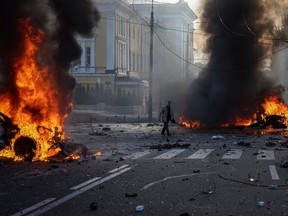 Cars burn after Russian military strike, as Russia's invasion of Ukraine continues, in central Kyiv, Ukraine October 10, 2022.