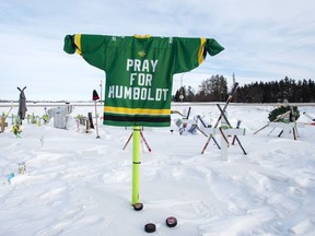 A memorial for the 2018 crash where 16 people died and 13 injured when a truck collided with the Humboldt Broncos hockey team bus, is shown at the crash site on Wednesday, January 30, 2019 in Tisdale, Saskatchewan. Families of those killed or injured in the crash are raising concerns that provincial requirements for truck driving licences coul be loosened as the industry deals with a shortage of drivers.