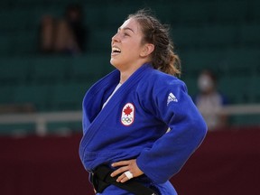 Catherine Beauchemin-Pinard of Canada reacts after winning the women's 63kg bronze medal match against Anriquelis Barrios of Venezuela, unseen, in the judo match at the 2020 Summer Olympics in Tokyo, Japan, Tuesday, July 27, 2021.